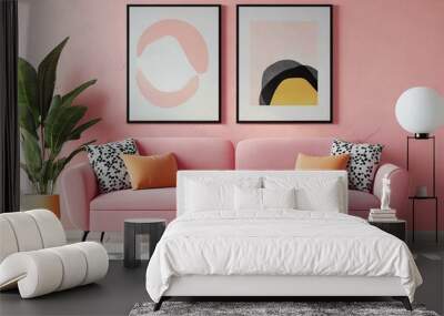 Pink sofa and chair near wall with two art poster mock up frames. Postmodern memphis style interior design of modern living room. Created with Wall mural