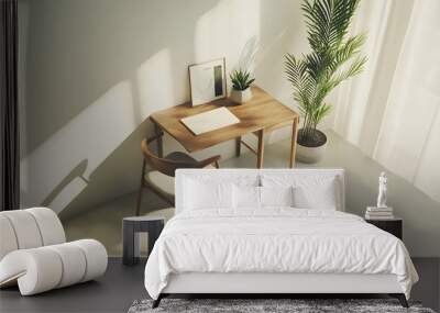 A minimalist desk setup with a wooden chair and a small potted plant, viewed from a birds-eye angle, creating a cozy and calm indoor workspace. Wall mural