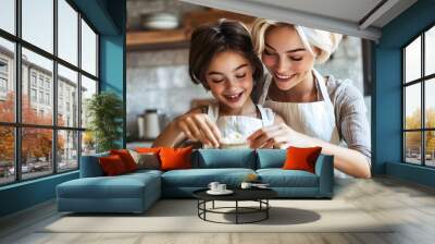 Lifestyle photo of a woman baking with her dauther Wall mural