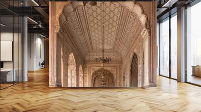 Beautiful row of aligned arches behind the facade of ancient Badshahi mosque built by mughal emperor Aurangzeb a landmark of Lahore, Punjab, Pakistan Wall mural