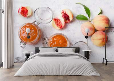 Homemade peach jam with organic fruit. Sweet preserves on a light background Wall mural