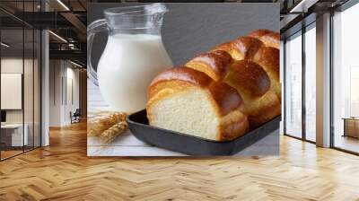 Brioche bread with milk closeup isolated on table closeup. Homemade bakery. Wall mural