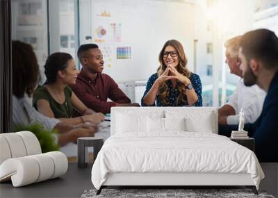 Alone we can think, together we can create. Shot of creative employees working in a modern office. Wall mural