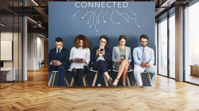 Connected, communication and network of diverse business people using multimedia technology, waiting for an interview. Professional group sitting in a row, applying for an International job Wall mural