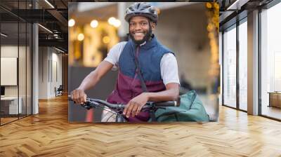 Black man, bicycle and portrait smile in the city for travel, trip or delivery with bag outdoors. Happy African American male on bike smiling for traveling, adventure or transport in an urban town Wall mural