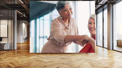 Meeting, handshake and collaboration with a business woman in partnership with her team in the boardroom. Welcome, teamwork and diversity with a female leader and employee group working in the office Wall mural