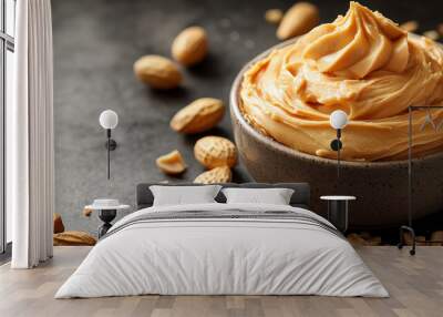 Bowl with tasty peanut butter on table, closeup. Space for text Wall mural