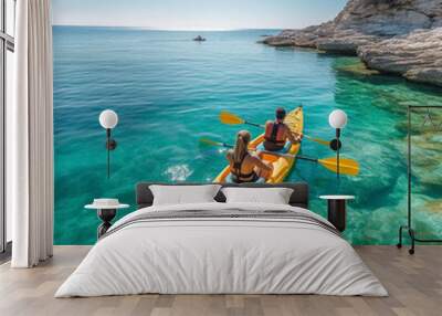 Couple kayaking in blue sea in vacations Wall mural