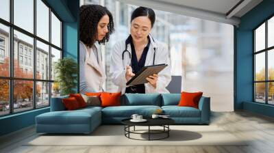 Doctor, woman patient and tablet for consulting with results, medical info and talk for healthcare with mockup space. Japanese medic, digital touchscreen or show video for surgery, wellness or advice Wall mural