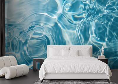 Clear water in swimming pool with ripple in clean aqua liquid. Summer wallpaper blue background and reflection of sunlight on water surface. Wall mural