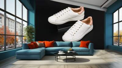 Women's sport leather shoes on black background. Wall mural