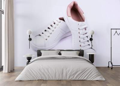 Women's sport shoes on white background Wall mural