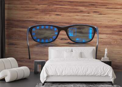 Pair of orange smart glasses laying on black desk. AR overlay showing functions. Wall mural