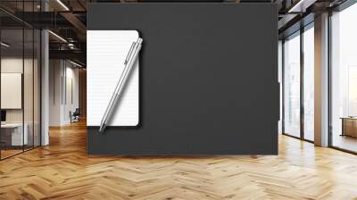 Black open lined notebook with a pen isolated on dark background. Horizontal banner Wall mural