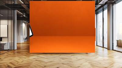 Floating tablet pc computer isolated on orange. Horizontal banner background Wall mural