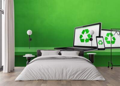 Laptop, tablet PC and smartphone on a shelf with a recycle symbol on screen. environmental conservation concept Wall mural