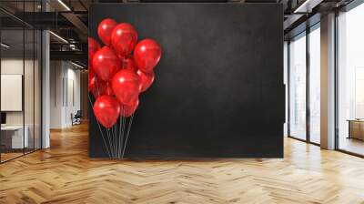 Red balloons bunch on a black wall background. Horizontal banner. Wall mural