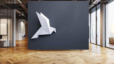 White paper dove origami isolated on a grey background Wall mural