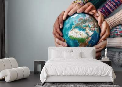 A diverse group of hands holding a globe, symbolizing unity, collaboration, and global responsibility. This image embodies the essence of coming together for a better world. Wall mural