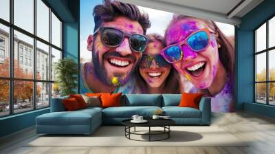 A lively group of friends covered in Holi festival colors, each expressing joy and happiness, captured outdoors in a scene that transmits the essence of vibrant celebration. Wall mural