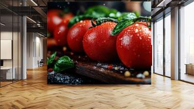 Ripe tomatoes with dewdrops arranged neatly on a wooden cutting board, complemented by fresh basil leaves, presenting a fresh culinary ingredient ready for use. Wall mural