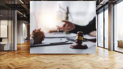 concept of justice and law A male judge in the courtroom on a wooden table and a male counselor or lawyer working in the office. Law, advice and justice concepts. Wall mural