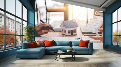 real estate agent Delivering sample homes to customers, mortgage loan contracts. Make a contract for hire purchase and sale of a house. and home insurance contracts, home mortgage loan concepts Wall mural