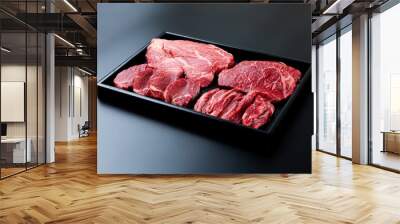 Sliced ​​beef on a black background Wall mural