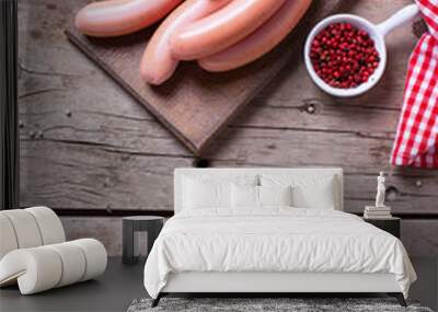 Sausages on board  with herb and spices on aged  wooden backgrou Wall mural