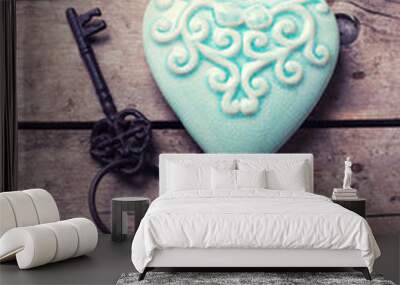 Turquoise decorative  heart and vintage key on aged wooden backg Wall mural