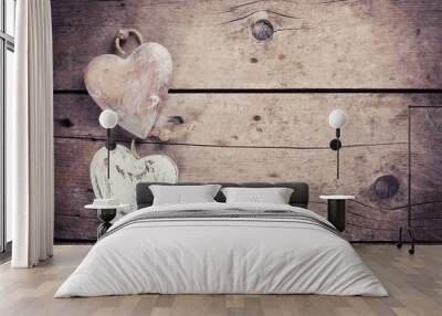 Two  rustic decorative  hearts on vintage wooden background Wall mural