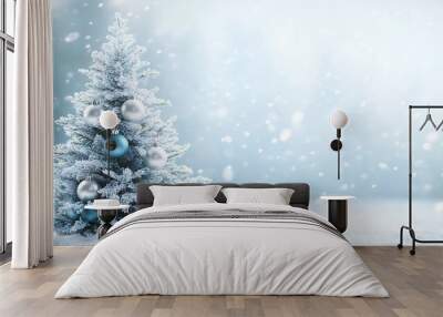 Elegant white and blue Christmas tree with shimmering silver ornaments and soft blue lights, set against a snowy background, leaving space at the bottom for text Wall mural