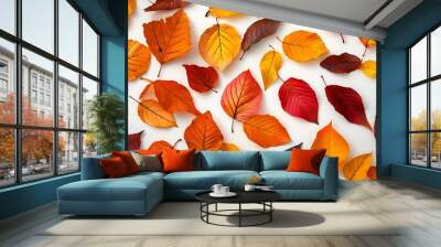 Top view of scattered autumn leaves with vibrant colors on an isolated white background, highlighting the natural beauty of fall Wall mural