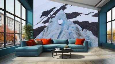 Hole in the ice at the top of a glacier with some beautiful blue colors Wall mural