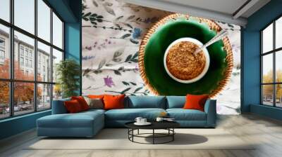 Brown sugar in white and green dish Wall mural