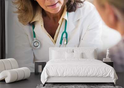 Doctor Discussing Leaflet With Female Patient Wall mural