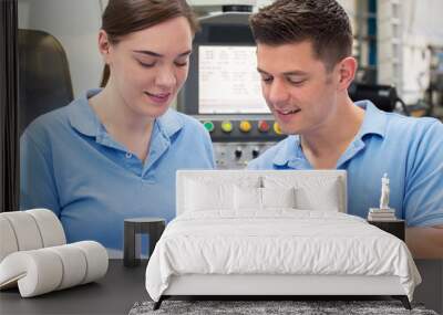 Engineer Instructing Female Apprentice On Use Of CNC Machine Wall mural