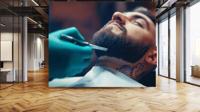 Man receiving a precise beard shave from a barber, close-up of hands holding a razor, modern barbershop environment, attention to detail, selective focus

 Wall mural