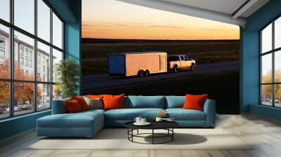 a white pickup truck pulls a small white box trailer down a rural highway during sunset hours. all v Wall mural