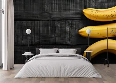 A bunch of bananas are sitting on a wooden table. Free copy space for banner. Wall mural