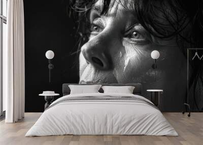 Close-up black and white portrait of a sorrowful middle-aged woman with tears. Free copy space for text. Wall mural