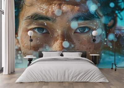 Close-up of a man's intense eyes as he surfs through water, with droplets splashing around. Wall mural