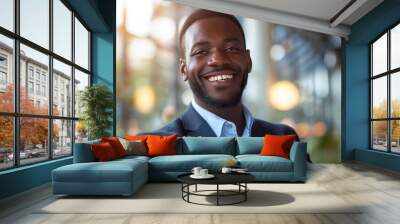 Confident African American businessman smiling in a professional setting. Wall mural