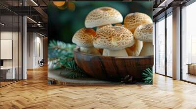 Fresh, organic mushrooms in a rustic wooden bowl with evergreen branches, perfect for natural cooking. Free copy space for text. Wall mural