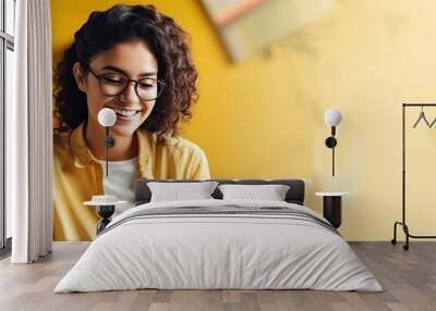 Happy young woman using laptop sitting at desk writing notes. Banner with empty copy space. Wall mural