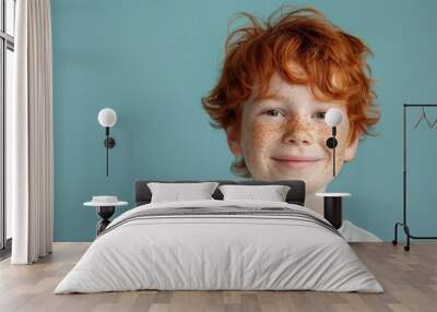 Smiling red-haired boy with freckles, close-up portrait. Free copy space for banner. Wall mural