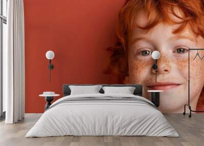 Smiling red-haired boy with freckles, close-up portrait. Free copy space for banner. Wall mural