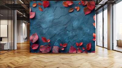 Vibrant red leaves contrast against a textured blue surface, creating a striking autumn-inspired visual. Free copy space for text. Wall mural