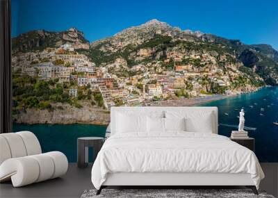 Aerial view of Positano with comfortable beach and blue sea on Amalfi Coast in Campania, Italy. Positano village on the Amalfi Coast, Salerno, Campania. Beautiful Positano, Amalfi Coast in Campania. Wall mural