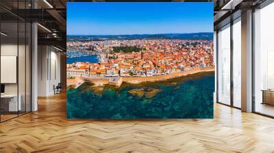 Aerial view over Alghero old town, cityscape Alghero view on a beautiful day with harbor and open sea in view. Alghero, Italy. Panoramic aerial view of Alghero, Sardinia, Italy. Wall mural